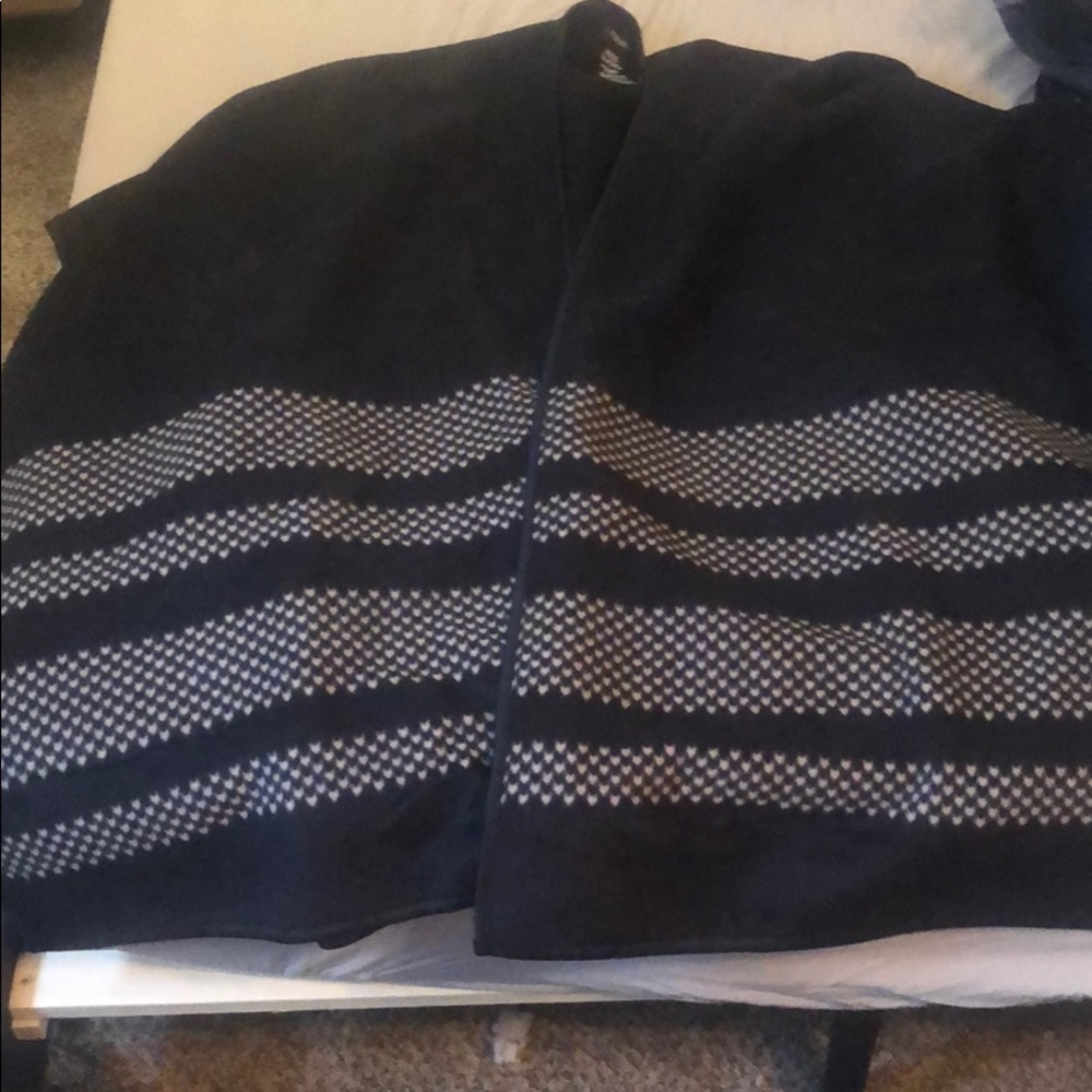 Black armless poncho with houndstooth pattern